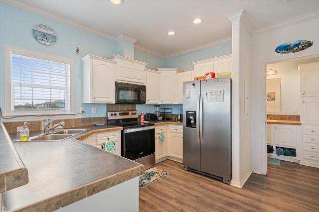 kitchen with sink, appliances with stainless steel finishes, crown molding, and dark wood-type flooring