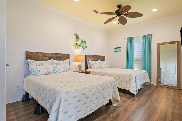 bedroom with ceiling fan, crown molding, and dark hardwood / wood-style flooring