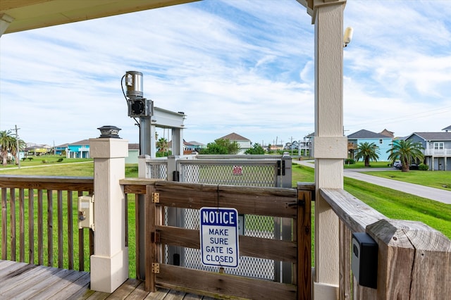 wooden deck with a lawn