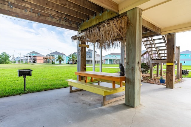 surrounding community with a patio and a yard