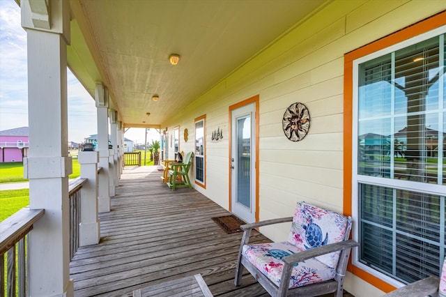 wooden terrace with a porch