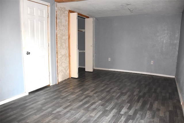 unfurnished bedroom featuring dark hardwood / wood-style floors