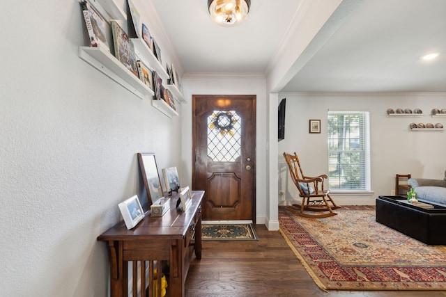 foyer entrance featuring ornamental molding and dark wood-type flooring