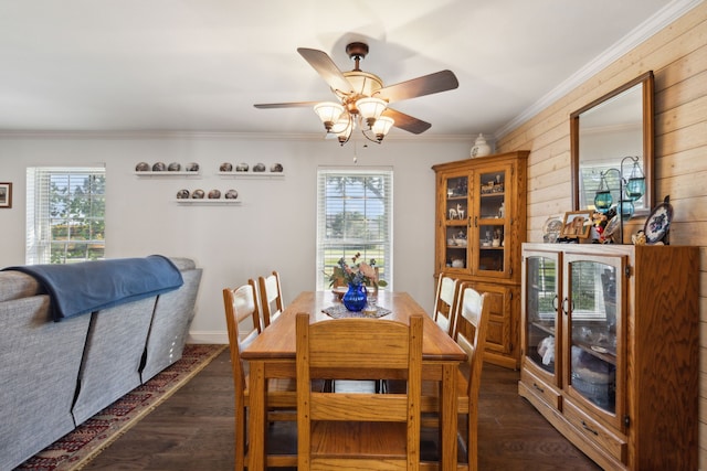 dining area with crown molding, dark hardwood / wood-style flooring, and plenty of natural light