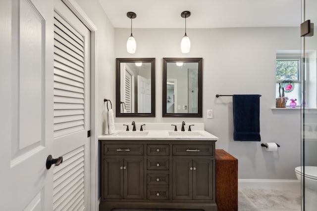 bathroom featuring vanity, toilet, and tile patterned floors