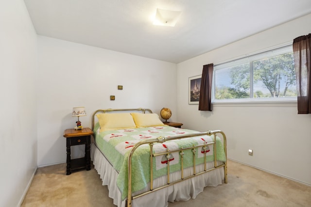 bedroom featuring light colored carpet