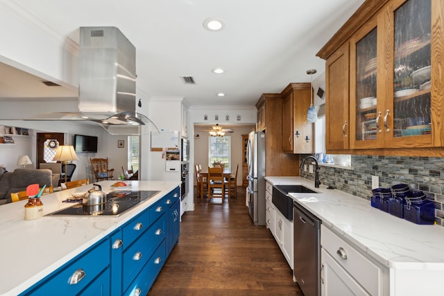 kitchen with appliances with stainless steel finishes, sink, white cabinets, light stone counters, and dark hardwood / wood-style floors