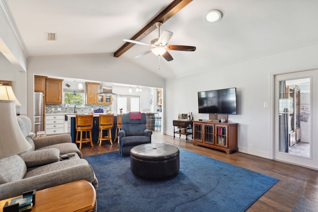 living room with sink, ceiling fan, dark hardwood / wood-style flooring, and vaulted ceiling with beams