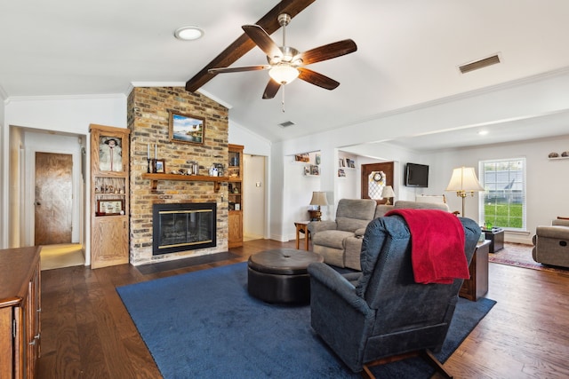 living room with vaulted ceiling with beams, crown molding, a brick fireplace, dark hardwood / wood-style flooring, and ceiling fan