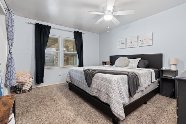 bedroom featuring ceiling fan and carpet