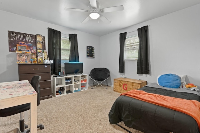 carpeted bedroom with ceiling fan and multiple windows