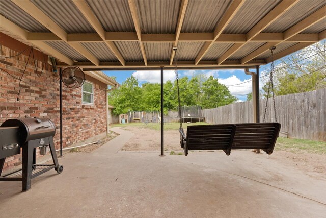 rear view of property with a patio and central AC