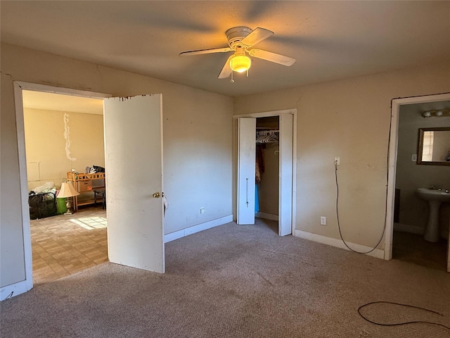 3525 Emerald Dr, Mesquite, TX 75150 - unfurnished bedroom featuring carpet, a closet, and a ceiling fan