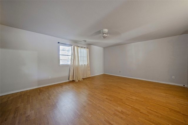 spare room with ceiling fan and light hardwood / wood-style floors