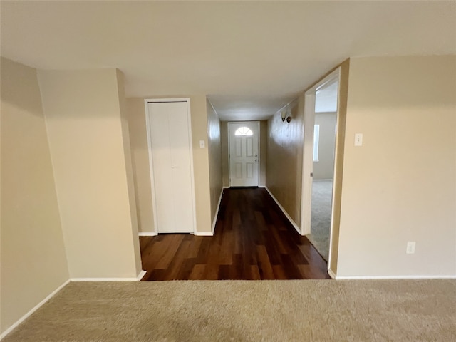 hall with dark hardwood / wood-style floors