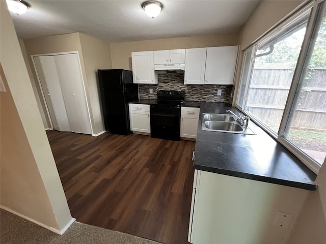 kitchen featuring tasteful backsplash, white cabinets, black appliances, dark hardwood / wood-style floors, and sink