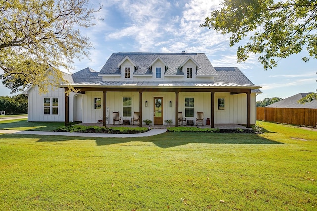 view of front of home featuring a front lawn and covered porch