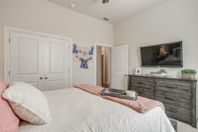 carpeted bedroom with a closet