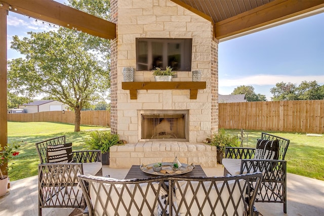 view of patio with an outdoor stone fireplace