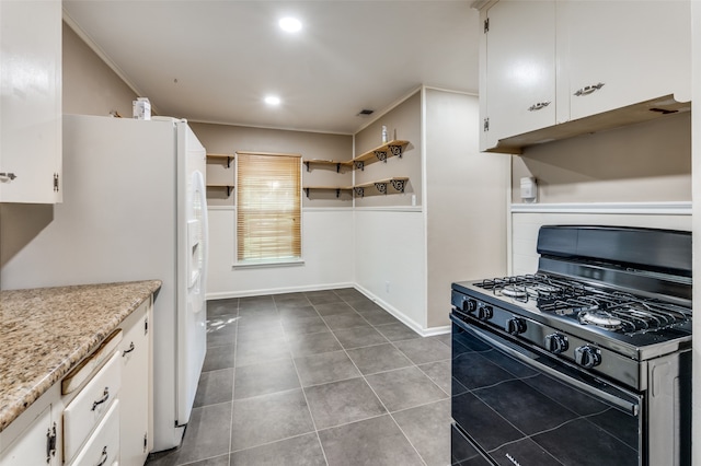 kitchen featuring black gas stove, white fridge with ice dispenser, white cabinetry, and crown molding