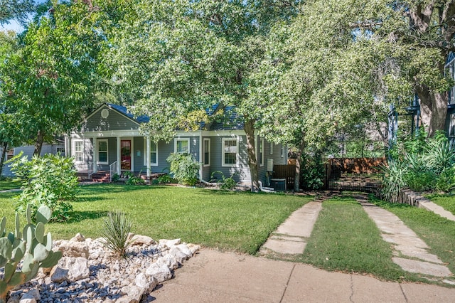 view of front of house featuring a front lawn and covered porch