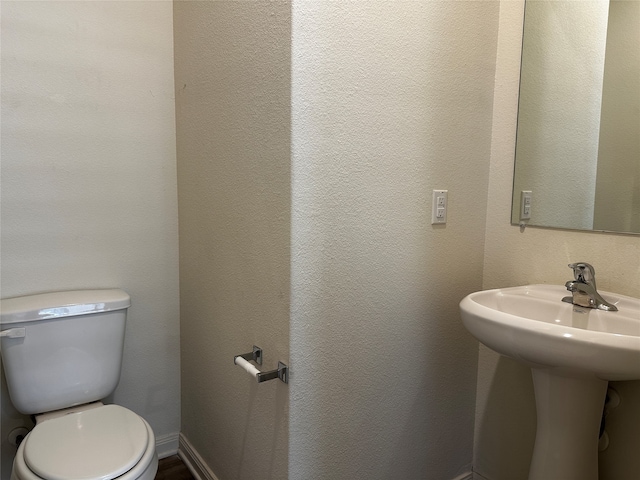 bathroom with sink and toilet