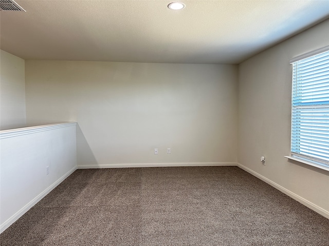 empty room featuring carpet floors