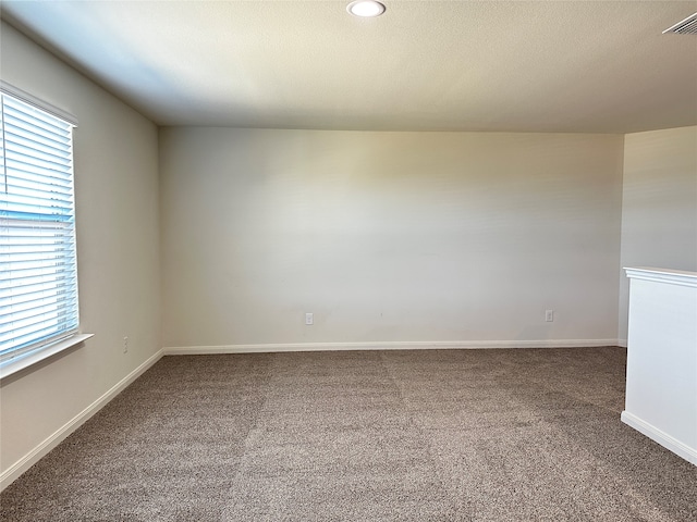 unfurnished room featuring carpet floors