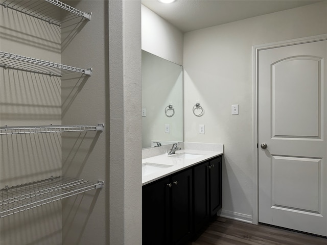 bathroom featuring vanity and hardwood / wood-style floors