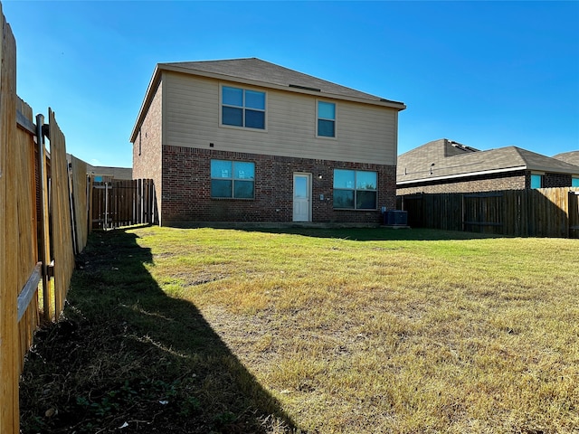 back of property featuring a yard