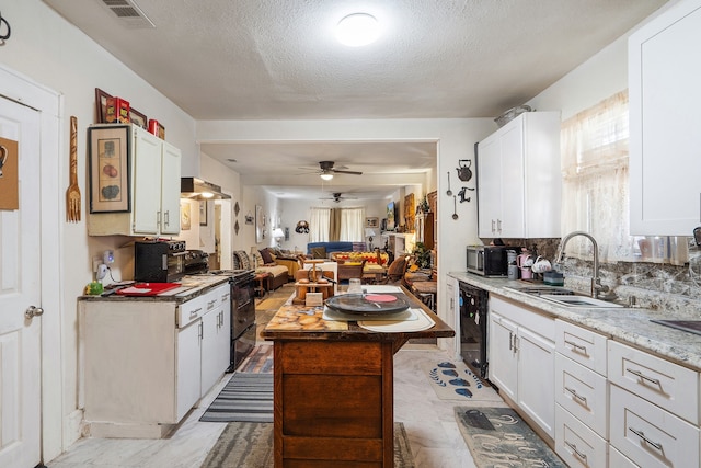 kitchen with white cabinets, ceiling fan, and electric range