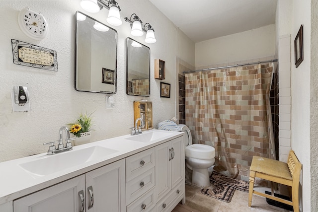 bathroom with tile patterned flooring, a shower with curtain, vanity, and toilet