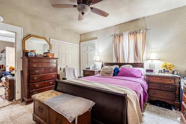 bedroom featuring a closet, ceiling fan, and a textured ceiling