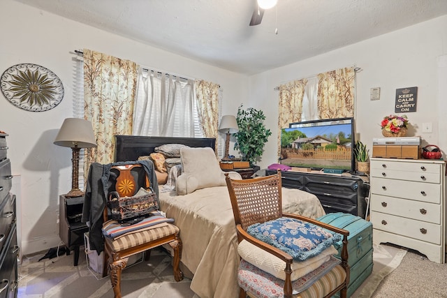 bedroom with ceiling fan and light colored carpet