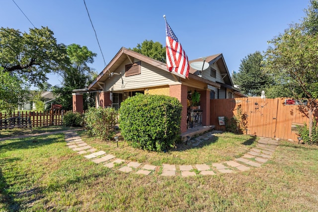 view of side of property featuring a yard