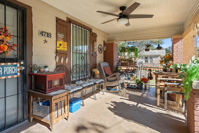 view of patio with ceiling fan and a porch