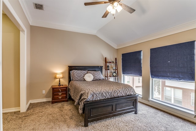 bedroom with crown molding, vaulted ceiling, ceiling fan, and light colored carpet