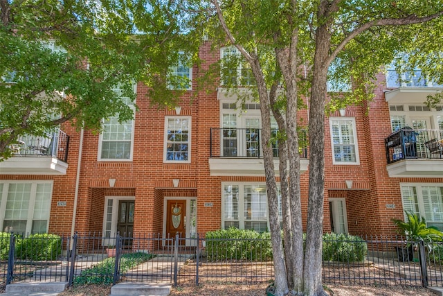 multi unit property featuring a balcony