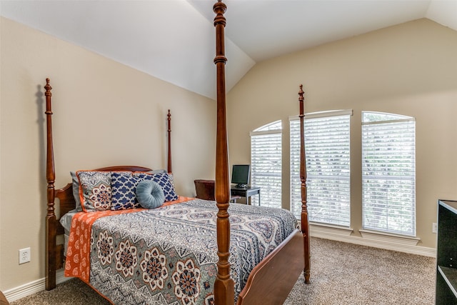 bedroom with carpet flooring and vaulted ceiling