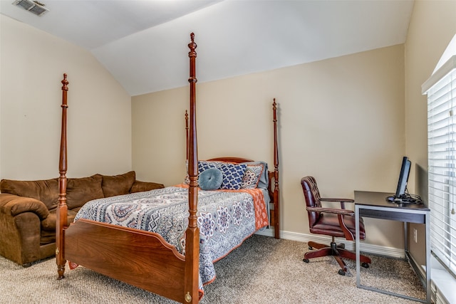 bedroom featuring vaulted ceiling and carpet floors