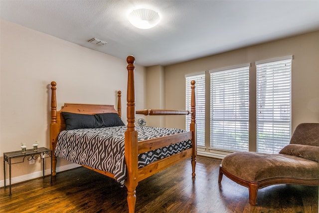 bedroom featuring dark hardwood / wood-style floors