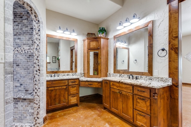 bathroom with a shower and vanity