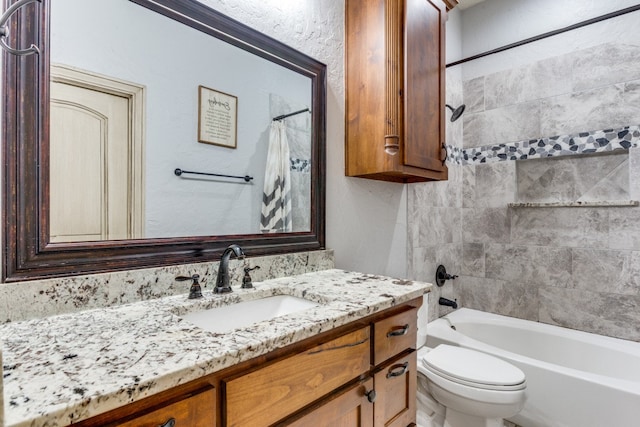 full bathroom with shower / tub combo, vanity, and toilet