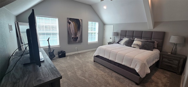 carpeted bedroom with vaulted ceiling and multiple windows