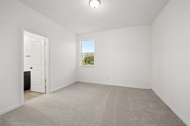 unfurnished bedroom with light carpet