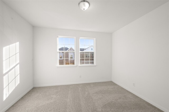 empty room featuring light carpet