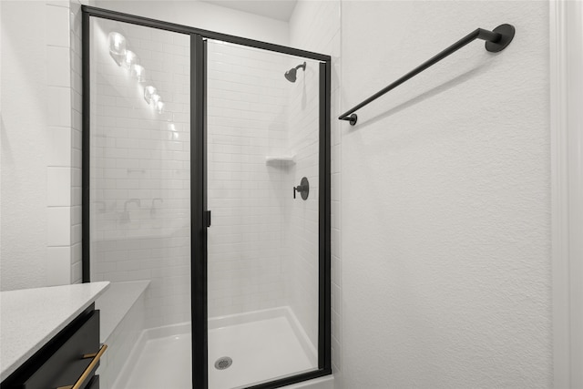 bathroom featuring vanity and walk in shower