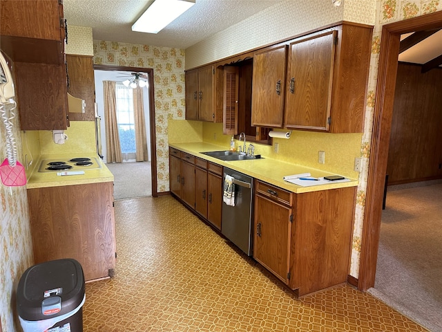 kitchen with a textured ceiling, sink, light colored carpet, ceiling fan, and stainless steel dishwasher