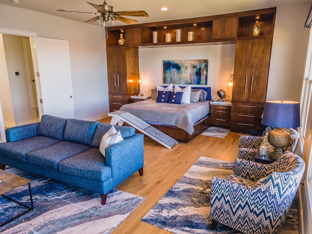 bedroom featuring light wood-type flooring and ceiling fan