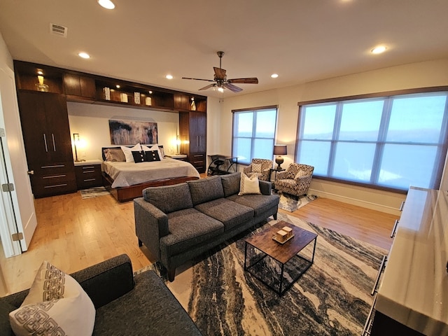 bedroom with ceiling fan and light wood-type flooring